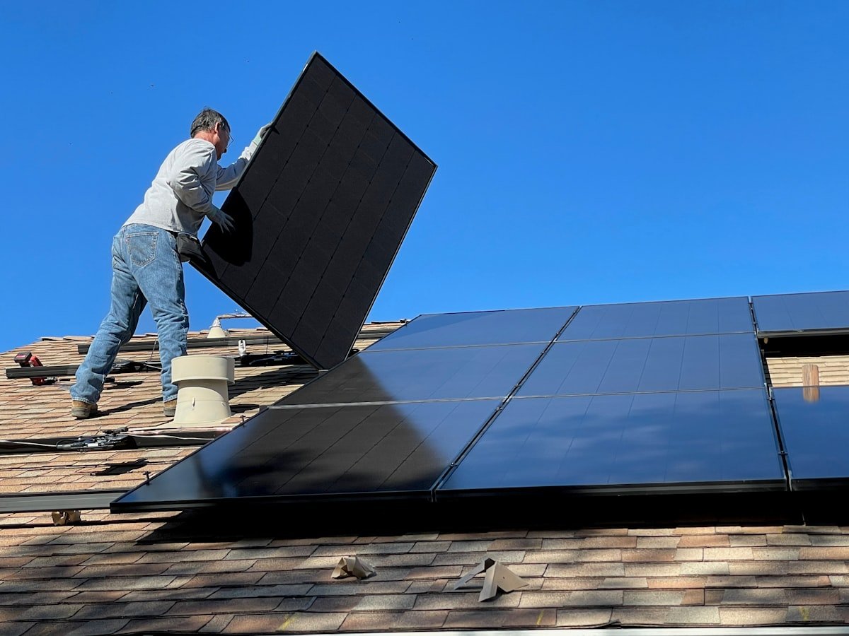 Technician installing solar panels